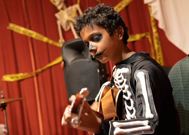 Young musician in the Orange Music Studio Guitar, Bass & Ukulele program